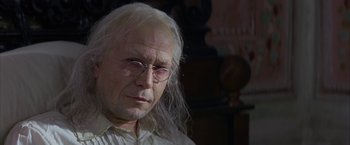 Movie still from “Immortal Beloved” (1994), directed by Bernard Rose – An old man with long white hair wearing glasses; Close Up shot, Low angle