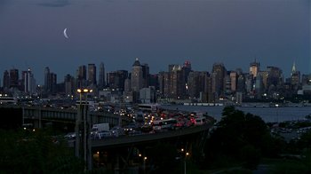 Movie still from “In America” (2002), directed by Jim Sheridan – A view of a city at night from a bridge; Extreme Wide shot, High angle
