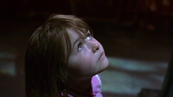 Movie still from “In America” (2002), directed by Jim Sheridan – A young girl looking up into the sky; Close Up shot, Low angle