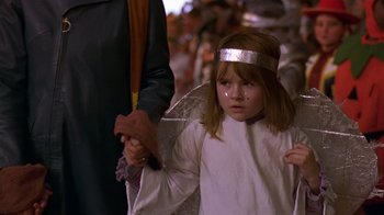 Movie still from “In America” (2002), directed by Jim Sheridan – A little girl dressed up as an angel; Medium shot, High angle