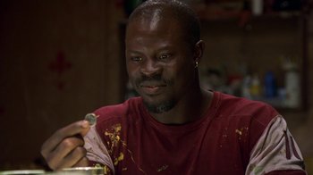 Movie still from “In America” (2002), directed by Jim Sheridan – A person eating food from a bowl; Close Up shot, Low angle