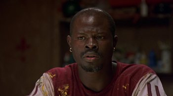 Movie still from “In America” (2002), directed by Jim Sheridan – A person wearing a red shirt; Close Up shot, Low angle