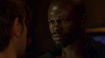 Movie still from “In America” (2002), directed by Jim Sheridan – A person with a beard; Close Up shot, Over the shoulder angle