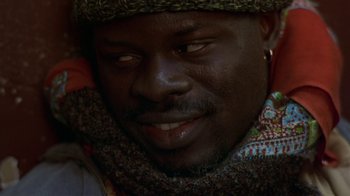 Movie still from “In America” (2002), directed by Jim Sheridan – A person wearing a hat; Close Up shot, Over the shoulder angle