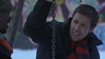 Movie still from “In America” (2002), directed by Jim Sheridan – A man in a black jacket and a red and black jacket; Close Up shot, Low angle