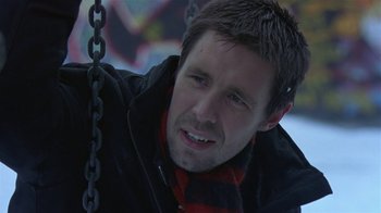 Movie still from “In America” (2002), directed by Jim Sheridan – A person sitting on a swing; Close Up shot, Low angle