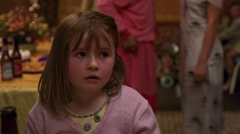 Movie still from “In America” (2002), directed by Jim Sheridan – A little girl wearing a pink sweater and a necklace; Close Up shot, Over the shoulder angle