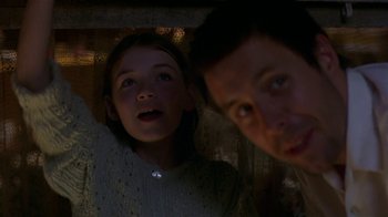 Movie still from “In America” (2002), directed by Jim Sheridan – A man and a girl looking up at the ceiling; Close Up shot, Low angle