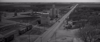 Movie still from “In Cold Blood” (1967), directed by Richard Brooks – An aerial view of an industrial area in the middle of the day; Extreme Wide shot, High angle