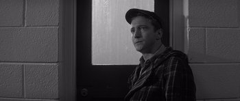 Movie still from “In Cold Blood” (1967), directed by Richard Brooks – A black and white photo of a man looking out of a window; Close Up shot, Low angle