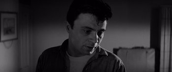 Movie still from “In Cold Blood” (1967), directed by Richard Brooks – Black and white photograph of a young man looking at the camera; Close Up shot, Low angle