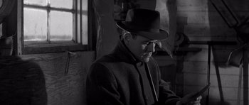 Movie still from “In Cold Blood” (1967), directed by Richard Brooks – A black and white photo of a man wearing a hat; Close Up shot, Low angle