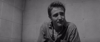 Movie still from “In Cold Blood” (1967), directed by Richard Brooks – Black and white photograph of a man in a shirt; Close Up shot, Low angle