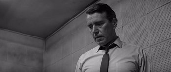 Movie still from “In Cold Blood” (1967), directed by Richard Brooks – Black and white photograph of a man wearing a neck tie; Close Up shot, Low angle