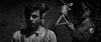 Movie still from “In Cold Blood” (1967), directed by Richard Brooks – A man with a rope around his neck and another man with a rope around his neck; Close Up shot, High angle
