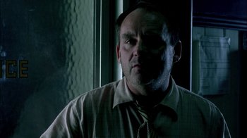 Movie still from “In Dreams” (1999), directed by Neil Jordan – A person wearing a shirt and a tie; Close Up shot, Low angle