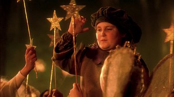Movie still from “In Dreams” (1999), directed by Neil Jordan – A child dressed as a witch holding a wand; Close Up shot, Low angle