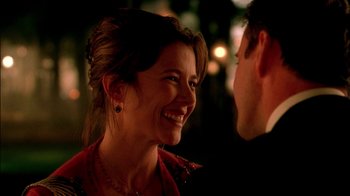 Movie still from “In Dreams” (1999), directed by Neil Jordan – A woman smiling at a man in a red shirt; Close Up shot, Over the shoulder angle