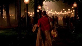 Movie still from “In Dreams” (1999), directed by Neil Jordan – A woman walking down a street at night; Wide shot, High angle