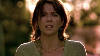 Movie still from “In Dreams” (1999), directed by Neil Jordan – A person wearing a sweater; Close Up shot, Over the shoulder angle