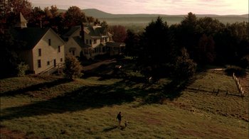 Movie still from “In Dreams” (1999), directed by Neil Jordan – An aerial view of a person and a dog in a field; Extreme Wide shot, High angle