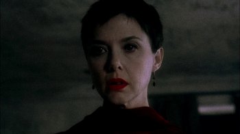 Movie still from “In Dreams” (1999), directed by Neil Jordan – A person with short black hair; Close Up shot, Low angle