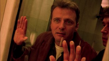 Movie still from “In Dreams” (1999), directed by Neil Jordan – A person holding their hands up; Close Up shot, Low angle