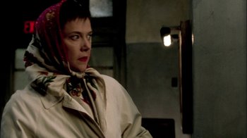 Movie still from “In Dreams” (1999), directed by Neil Jordan – A woman wearing a white jacket and a red scarf; Close Up shot, Over the shoulder angle
