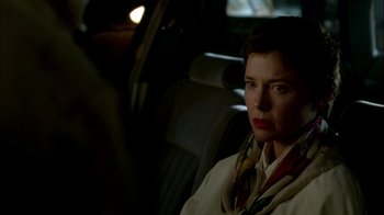 Movie still from “In Dreams” (1999), directed by Neil Jordan – A woman sitting in the back seat of a car; Close Up shot, Over the shoulder angle