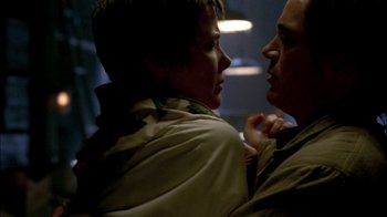 Movie still from “In Dreams” (1999), directed by Neil Jordan – A man and a woman face to face in a dark room; Close Up shot, Low angle