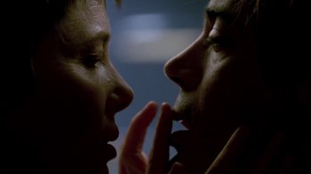 Movie still from “In Dreams” (1999), directed by Neil Jordan – Two people touching their faces to one another; Extreme Close Up shot, Low angle