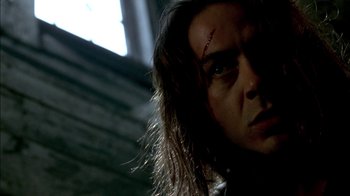 Movie still from “In Dreams” (1999), directed by Neil Jordan – A person with a scar on their face; Close Up shot, Low angle