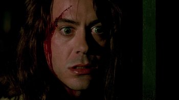 Movie still from “In Dreams” (1999), directed by Neil Jordan – A person with blood on their face; Close Up shot, Over the shoulder angle