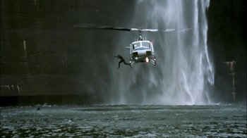 Movie still from “In Dreams” (1999), directed by Neil Jordan – A helicopter is flying through the air near a waterfall; Extreme Wide shot, High angle