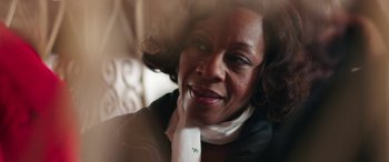 Movie still from “In Fabric” (2018), directed by Peter Strickland – A person wearing a neck tie; Close Up shot, Over the shoulder angle