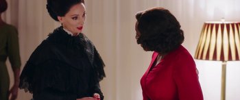 Movie still from “In Fabric” (2018), directed by Peter Strickland – Two women are standing next to each other; Medium shot, Over the shoulder angle