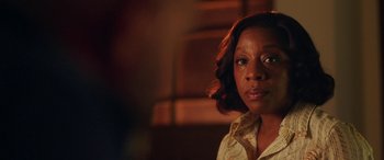 Movie still from “In Fabric” (2018), directed by Peter Strickland – A person wearing a shirt; Close Up shot, Over the shoulder angle