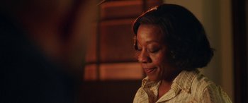 Movie still from “In Fabric” (2018), directed by Peter Strickland – A person looking down at something; Close Up shot, Over the shoulder angle