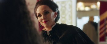 Movie still from “In Fabric” (2018), directed by Peter Strickland – A person wearing a dress; Close Up shot, Over the shoulder angle