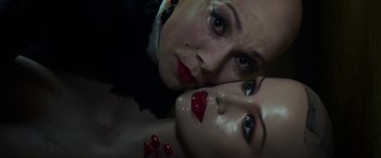 Movie still from “In Fabric” (2018), directed by Peter Strickland – A woman's face with red lipstick; Close Up shot, Overhead angle