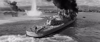 Movie still from “In Harm's Way” (1965), directed by Otto Preminger – An old photo of a boat in the water; Extreme Wide shot, High angle