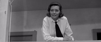 Movie still from “In Harm's Way” (1965), directed by Otto Preminger – Black and white photograph of a woman wearing a tie; Close Up shot, Low angle