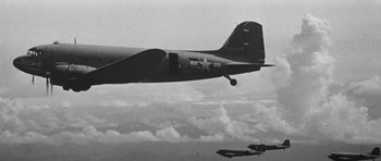 Movie still from “In Harm's Way” (1965), directed by Otto Preminger – A black and white photo of two planes flying in the sky; Wide shot, Low angle