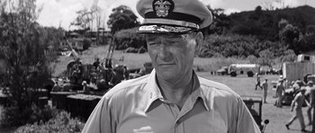Movie still from “In Harm's Way” (1965), directed by Otto Preminger – An old photo of a man in a military uniform; Close Up shot, Low angle
