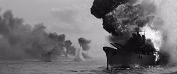 Movie still from “In Harm's Way” (1965), directed by Otto Preminger – A black - and - white photo of ships in the water; Extreme Wide shot, Low angle