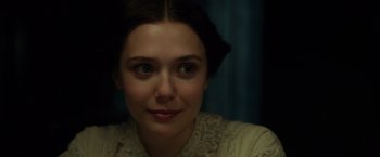 Movie still from “In Secret” (2013), directed by Charlie Stratton – A person wearing a white shirt; Close Up shot, Over the shoulder angle