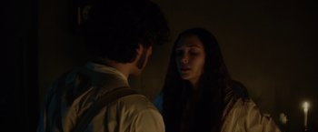 Movie still from “In Secret” (2013), directed by Charlie Stratton – A man and a woman looking at one another; Close Up shot, Over the shoulder angle