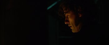 Movie still from “In Secret” (2013), directed by Charlie Stratton – A person's face in the dark; Close Up shot, Low angle