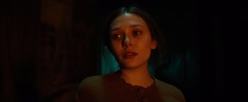 Movie still from “In Secret” (2013), directed by Charlie Stratton – A young woman is looking into the camera; Close Up shot, Low angle