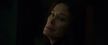 Movie still from “In Secret” (2013), directed by Charlie Stratton – A person looking at the camera; Close Up shot, Low angle